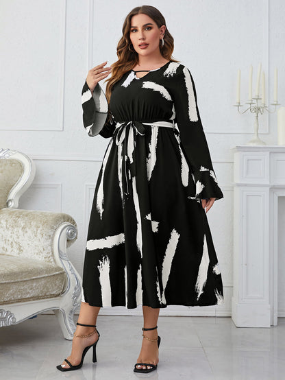 Melo Apparel Plus Size Printed Tie Belt Flare Sleeve Round Neck Midi Dress